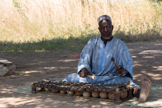 Musician at the Wassu Stone Circles (Click for next image)
